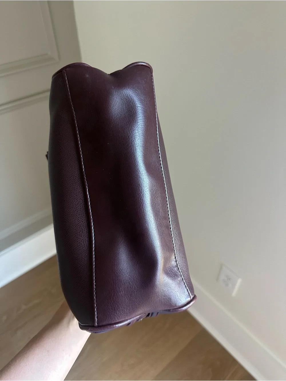 Vintage-inspired burgundy/oxblood structured handbag with gold accents